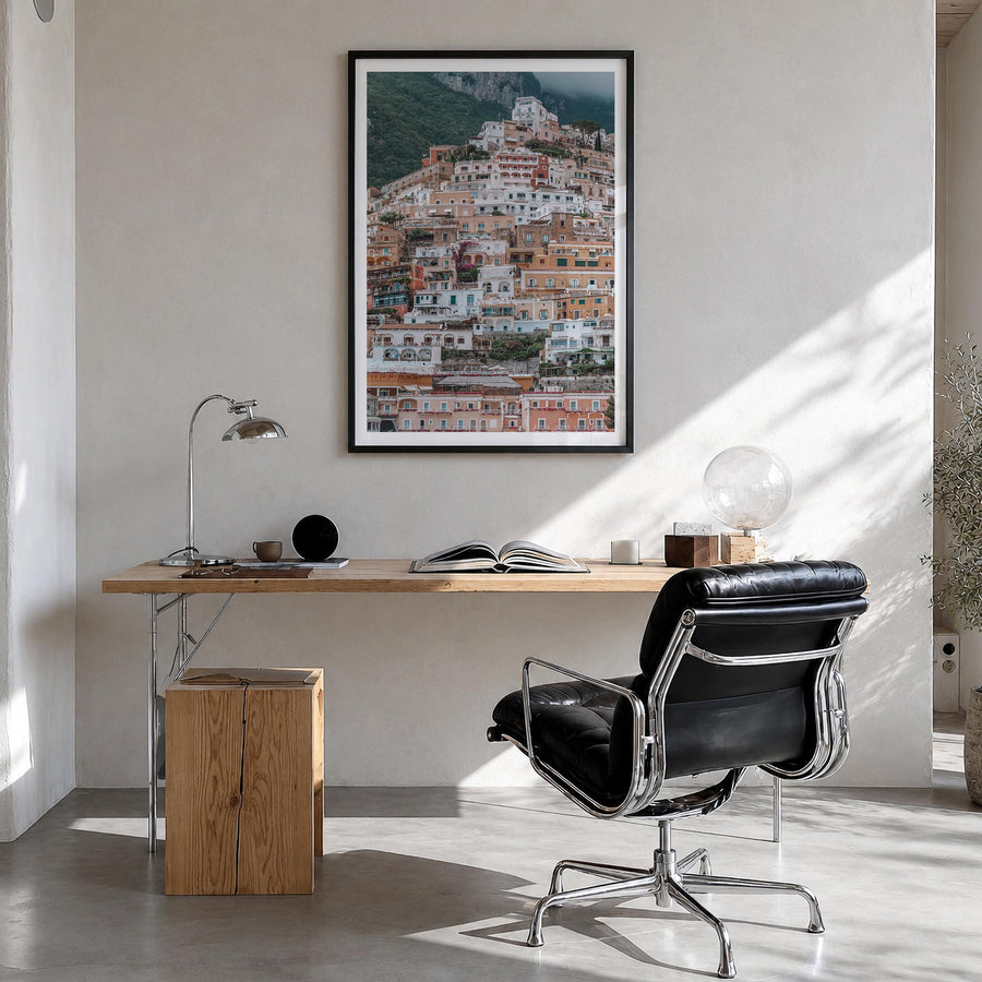 Positano no. 3 colorful photo poster of Italy – vertical wall art in black wood frame with white border, hanging on wall