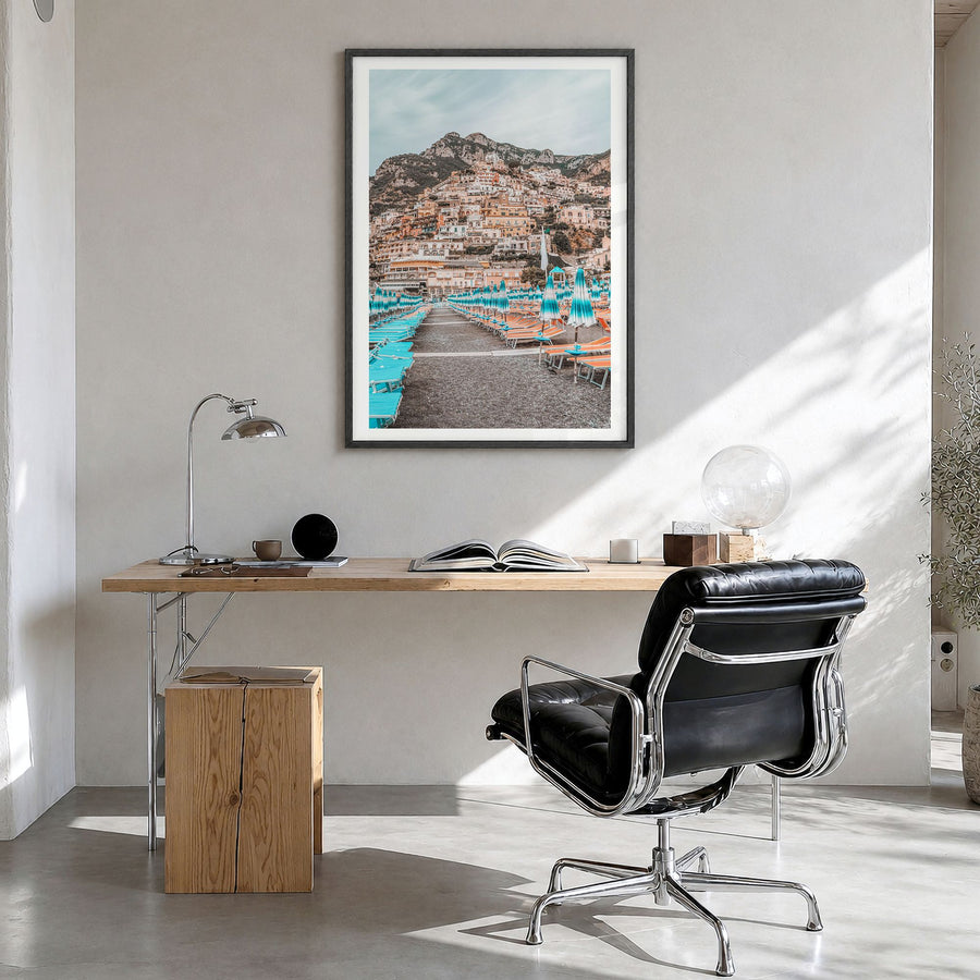 Positano Photo No 2 Poster in a black wood frame, hanging in a bright home office, white border