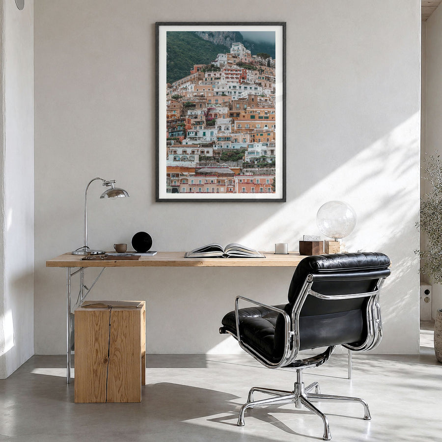 Positano Photo No 3 Poster in a black wood frame, hanging in a bright home office, white border