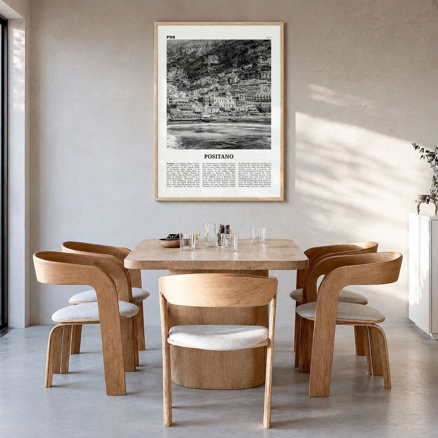Positano Newspaper No 2 Poster in a natural wood frame, hanging in a dining room