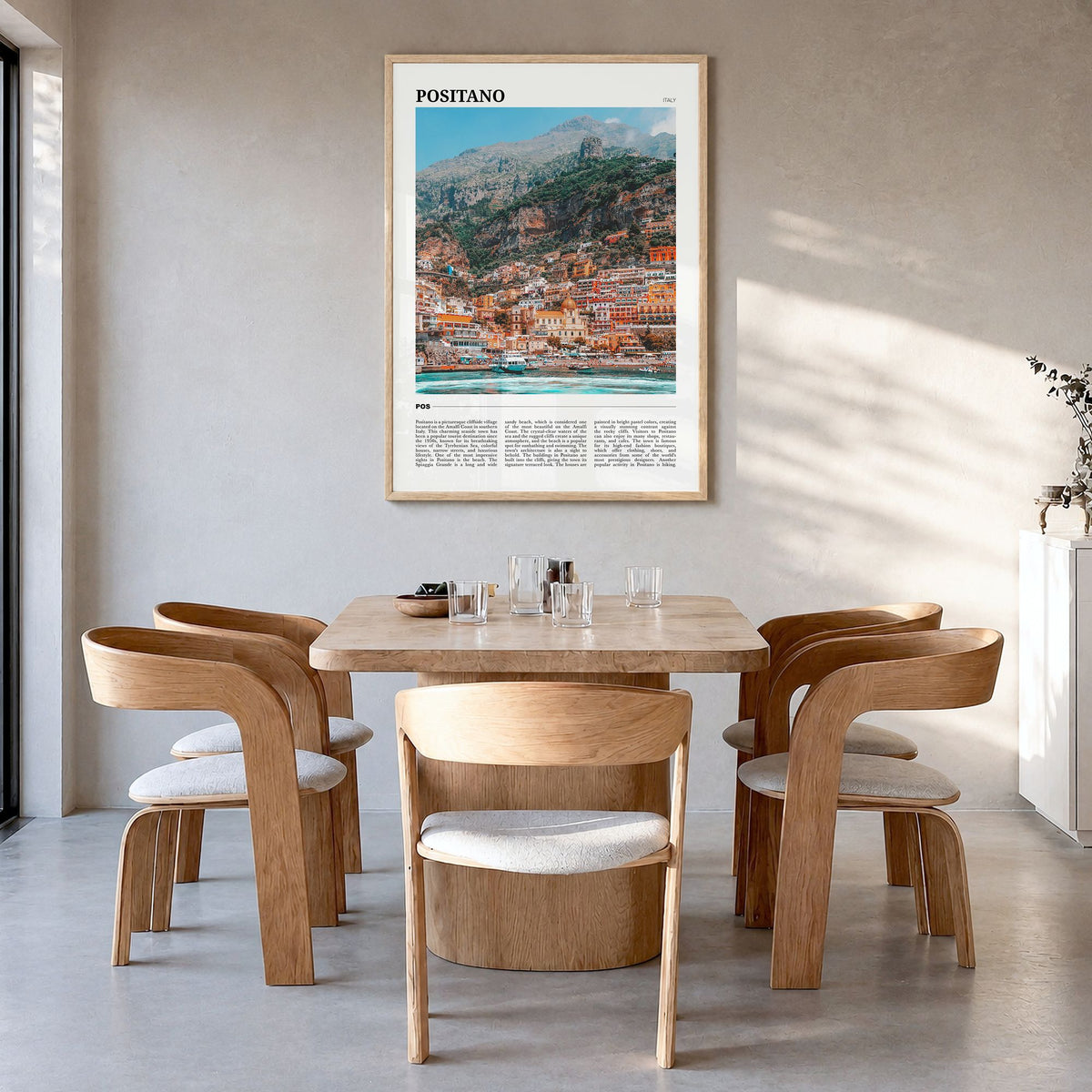 Positano Travel No 1 Poster in a natural wood frame, hanging in a dining room