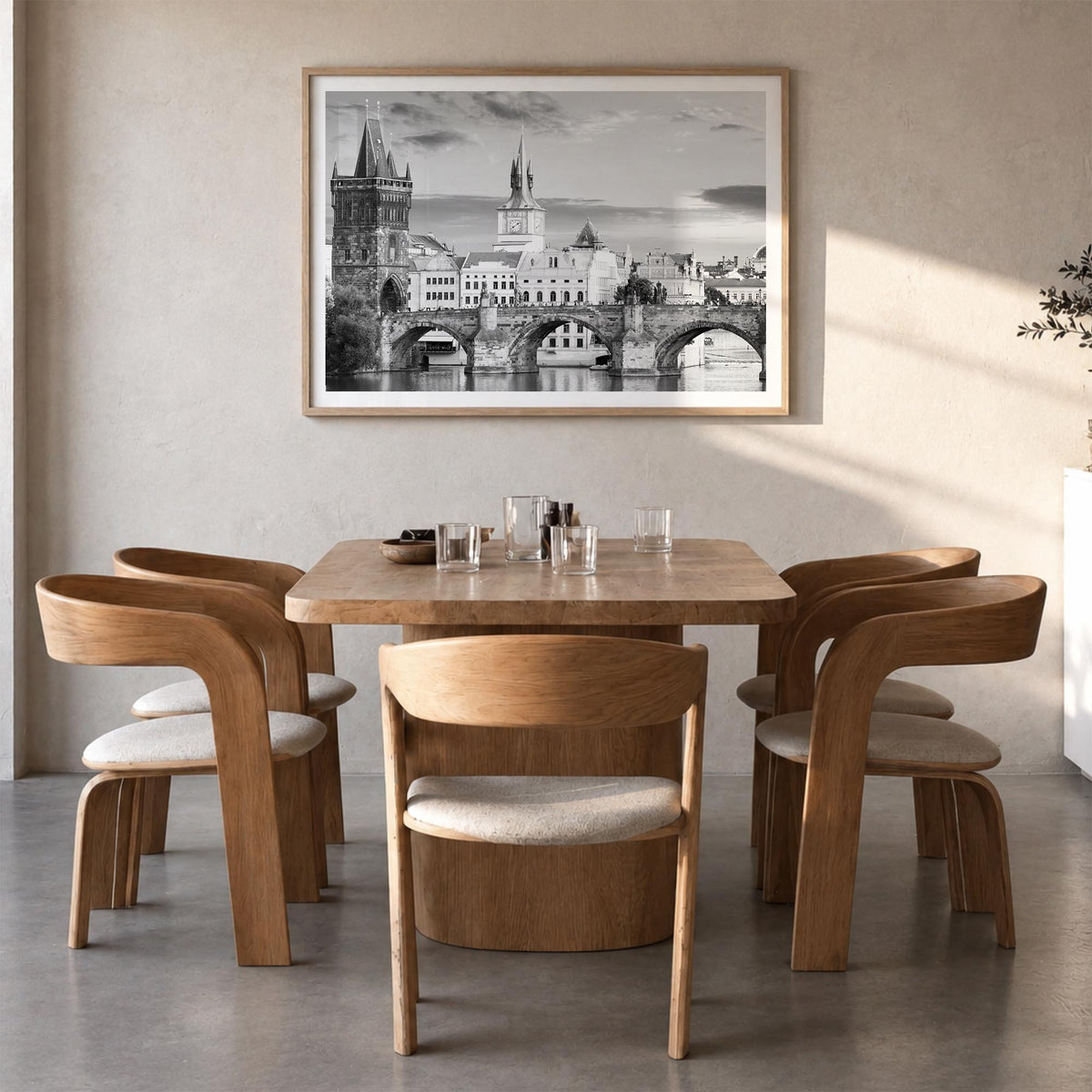 Prague black & white photo poster of Czechia – horizontal wall art in natural wood frame with white border, hanging on wall