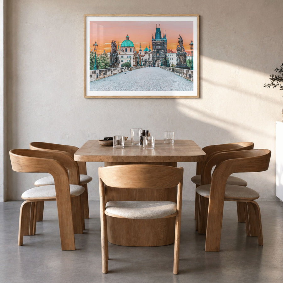 Prague Photo Poster in a natural wood frame, hanging in a dining room, white border