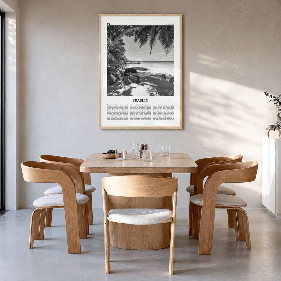 Praslin Newspaper Poster in a natural wood frame, hanging in a dining room