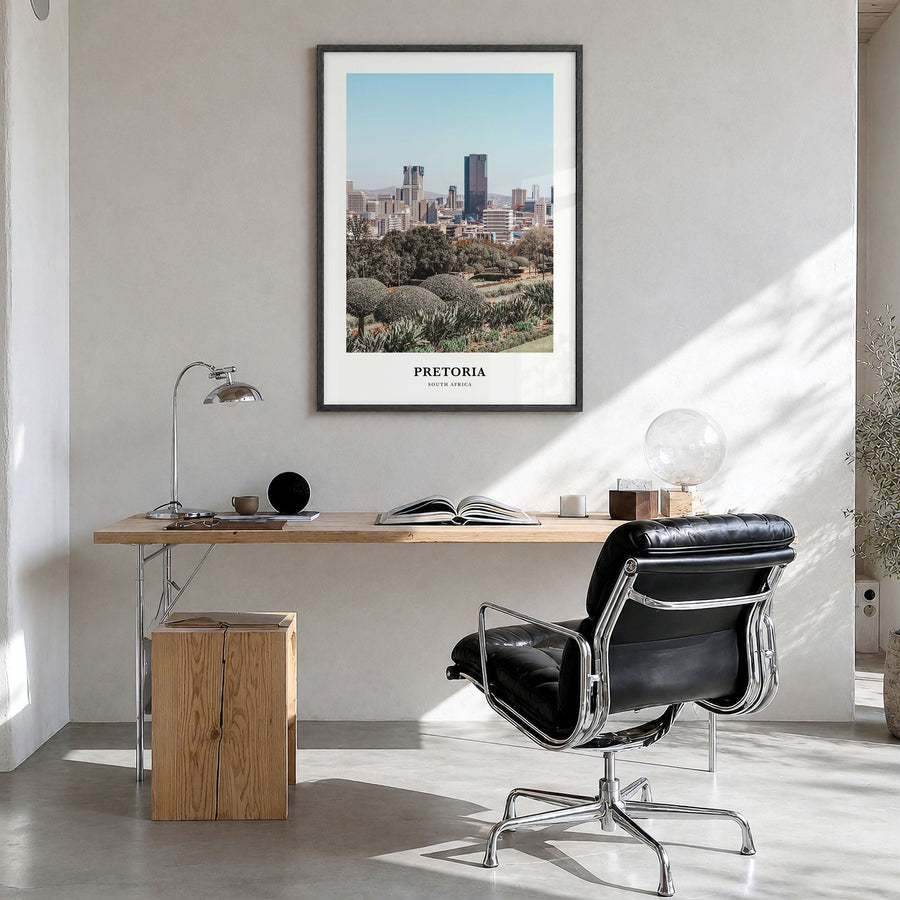 Pretoria Classic Poster in a black wood frame, hanging in a bright home office