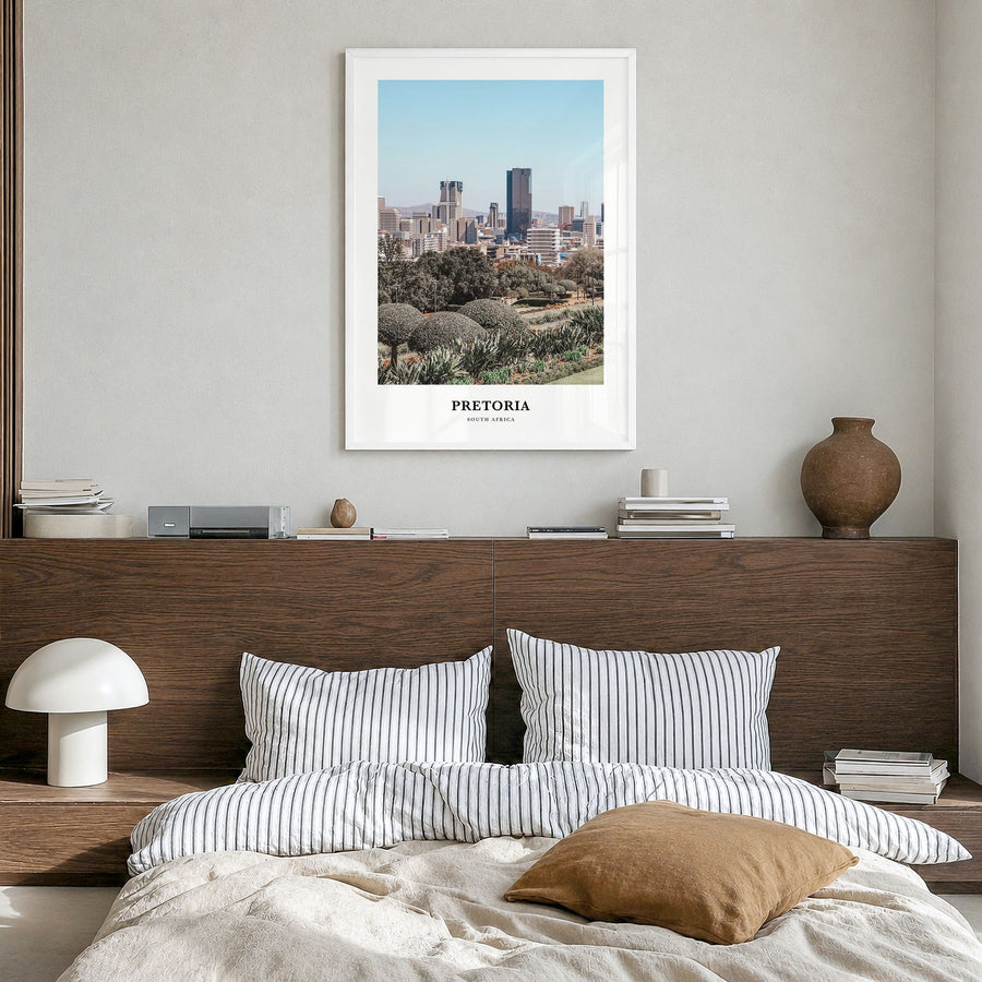 Pretoria Classic Poster in a white wood frame, hanging in a bedroom