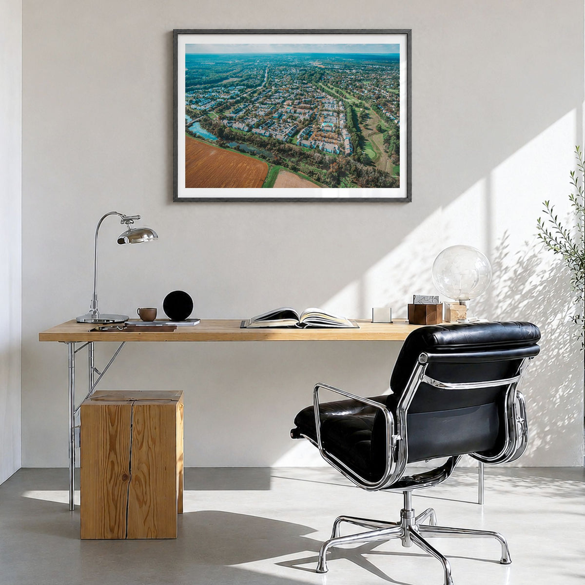 Princeton Photo Poster in a black wood frame, hanging in a bright home office, white border