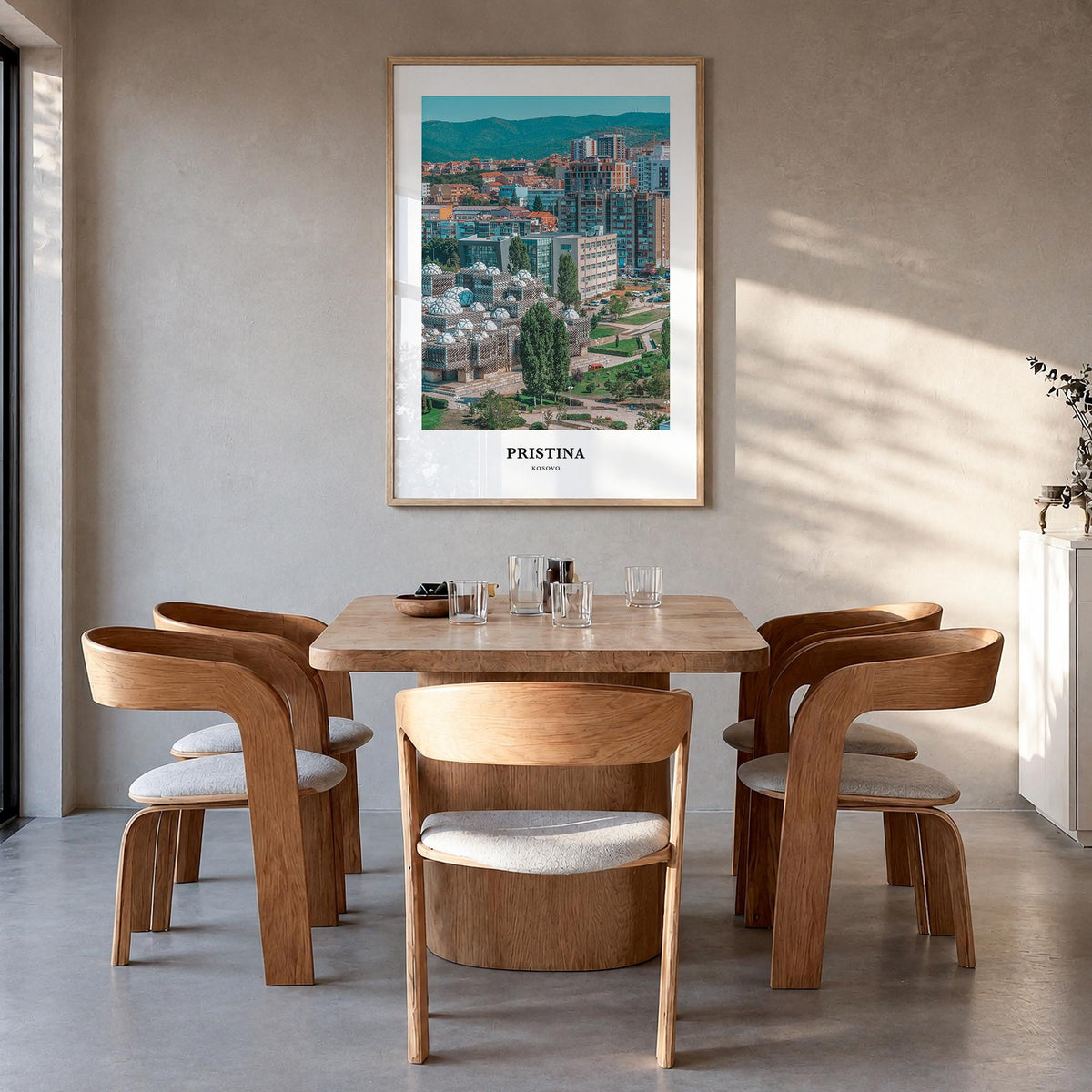 Pristina colorful classic poster of Kosovo – vertical wall art in natural wood frame, hanging on wall