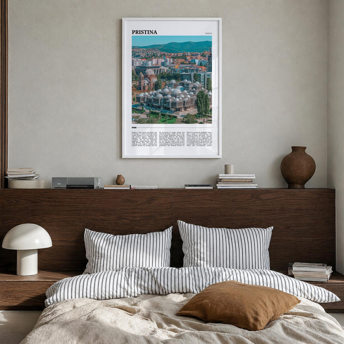 Pristina colorful travel poster of Kosovo – vertical wall art in white wood frame, hanging on wall