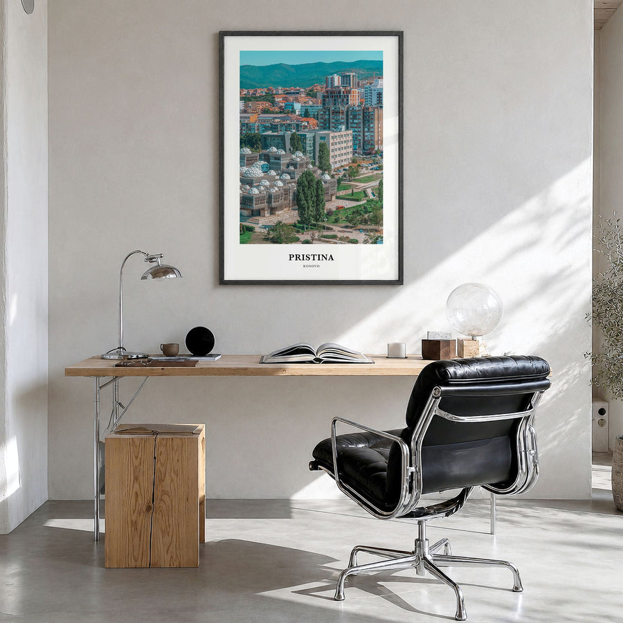 Pristina Classic Poster in a black wood frame, hanging in a bright home office