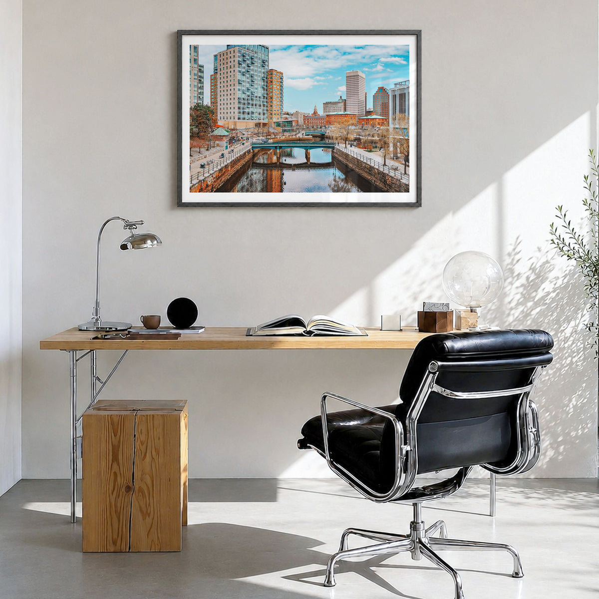 Providence Photo Poster in a black wood frame, hanging in a bright home office, white border