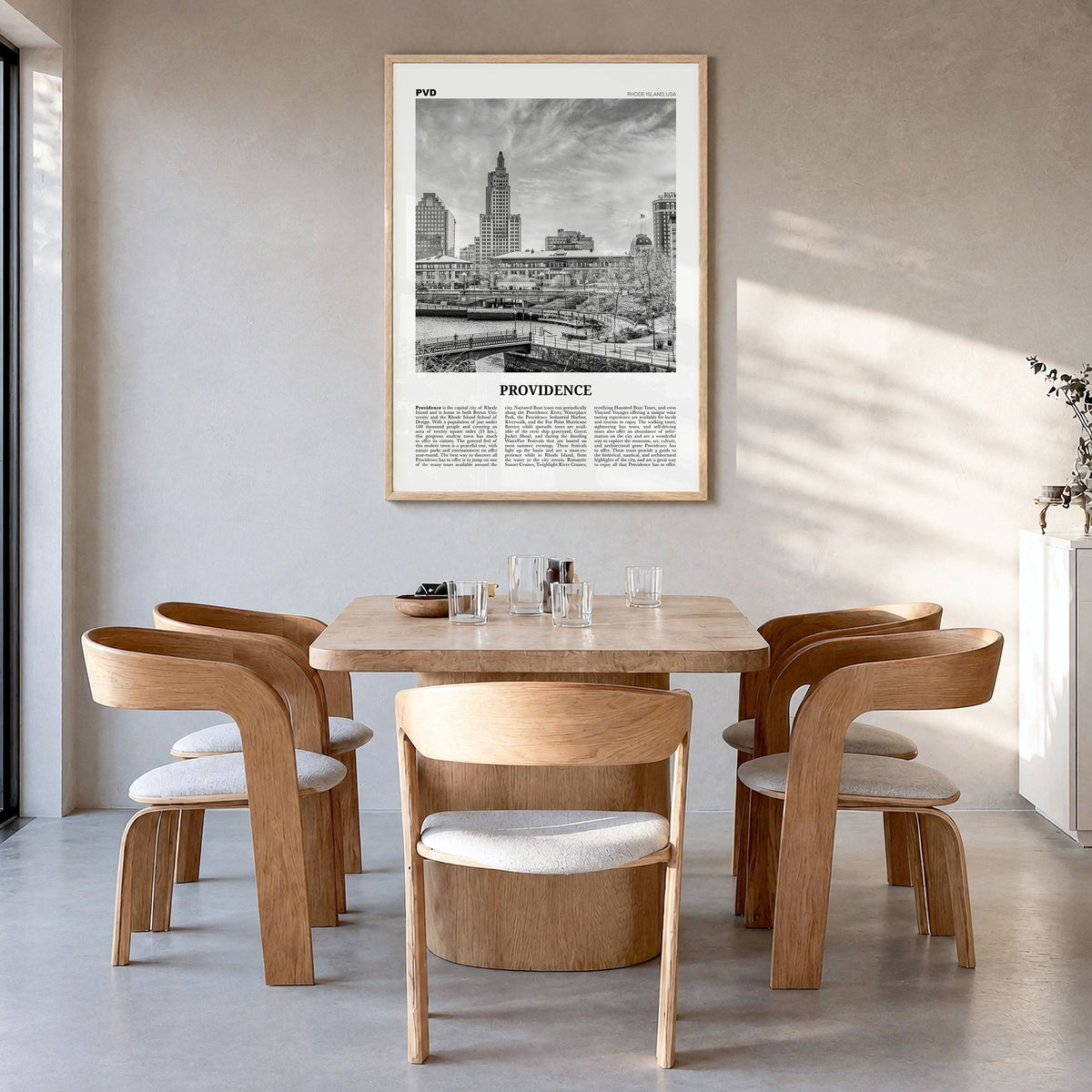 Providence Newspaper Poster in a natural wood frame, hanging in a dining room
