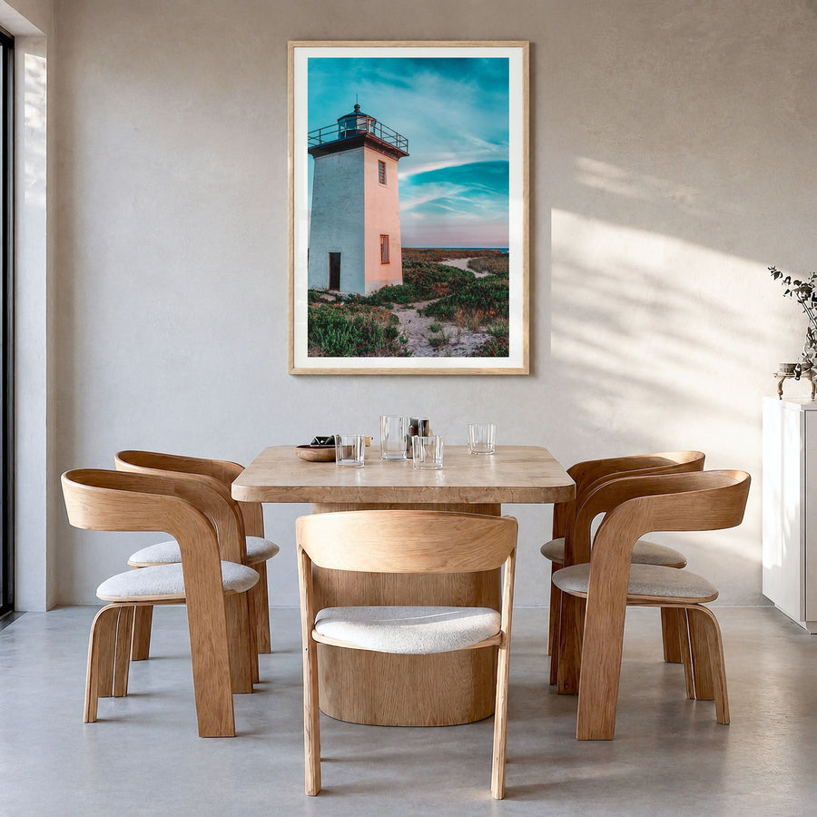 Provincetown Photo Poster in a natural wood frame, hanging in a dining room, white border