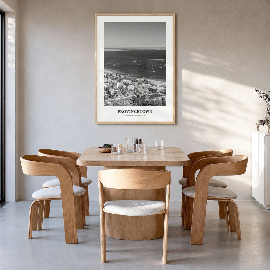Provincetown Classic Poster in a natural wood frame, hanging in a dining room