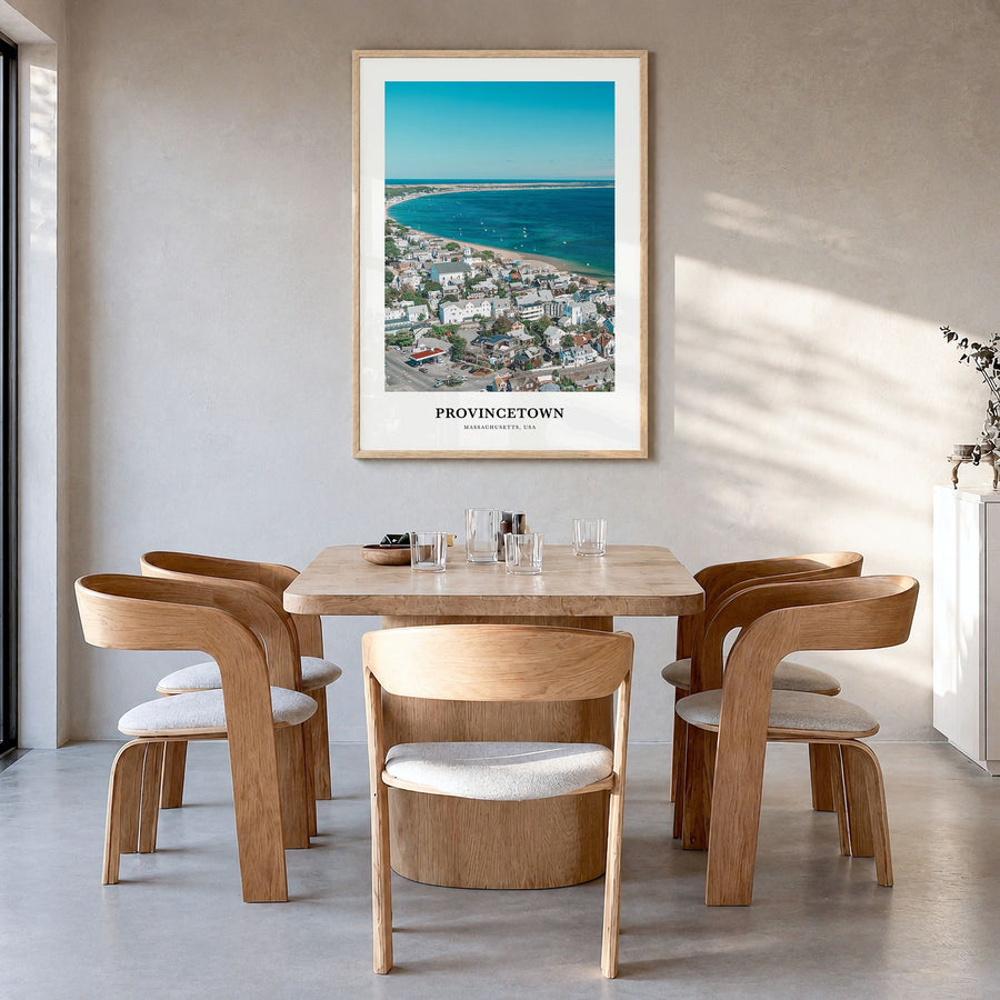 Provincetown Classic Poster in a natural wood frame, hanging in a dining room