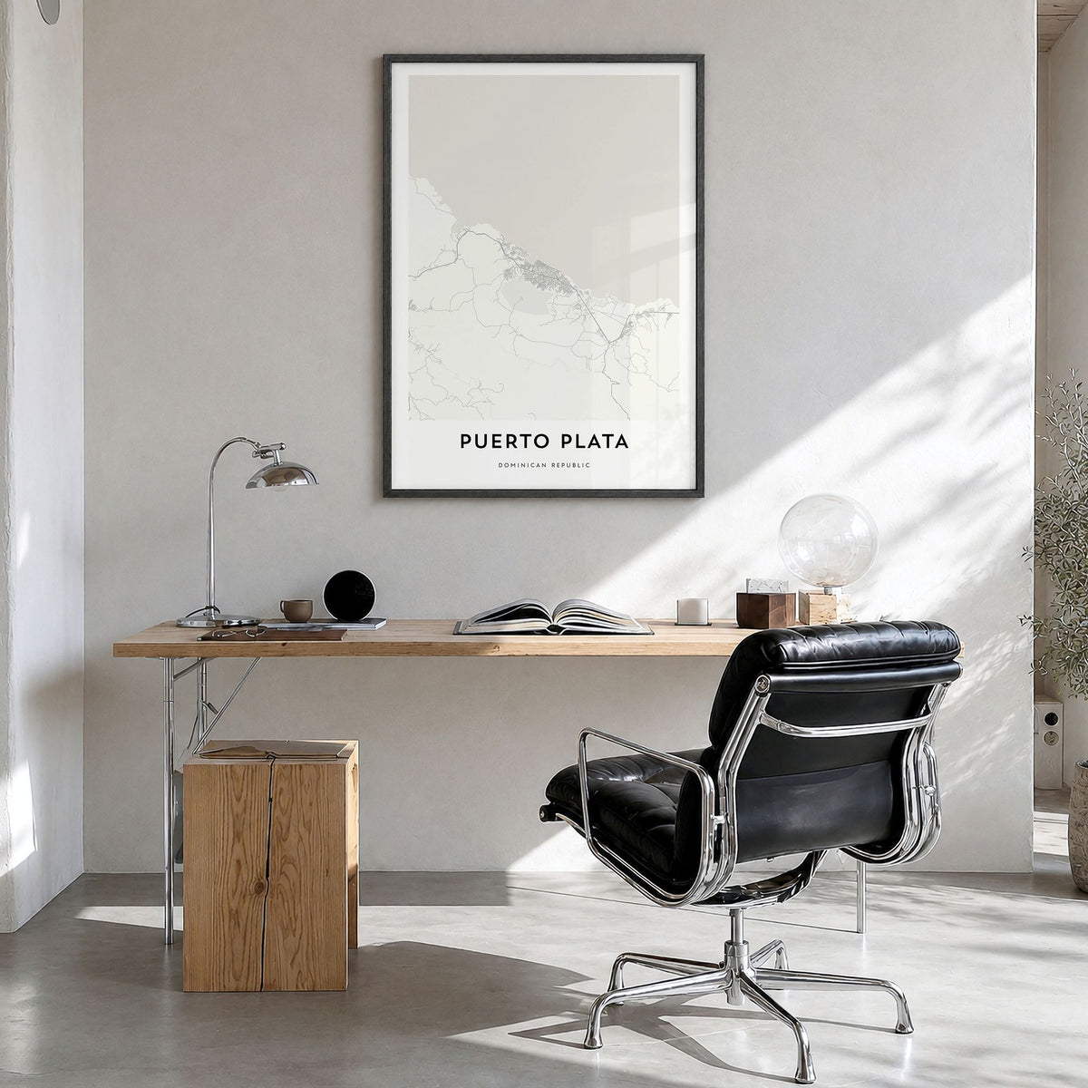Puerto Plata Map Poster in a black wood frame, hanging in a bright home office