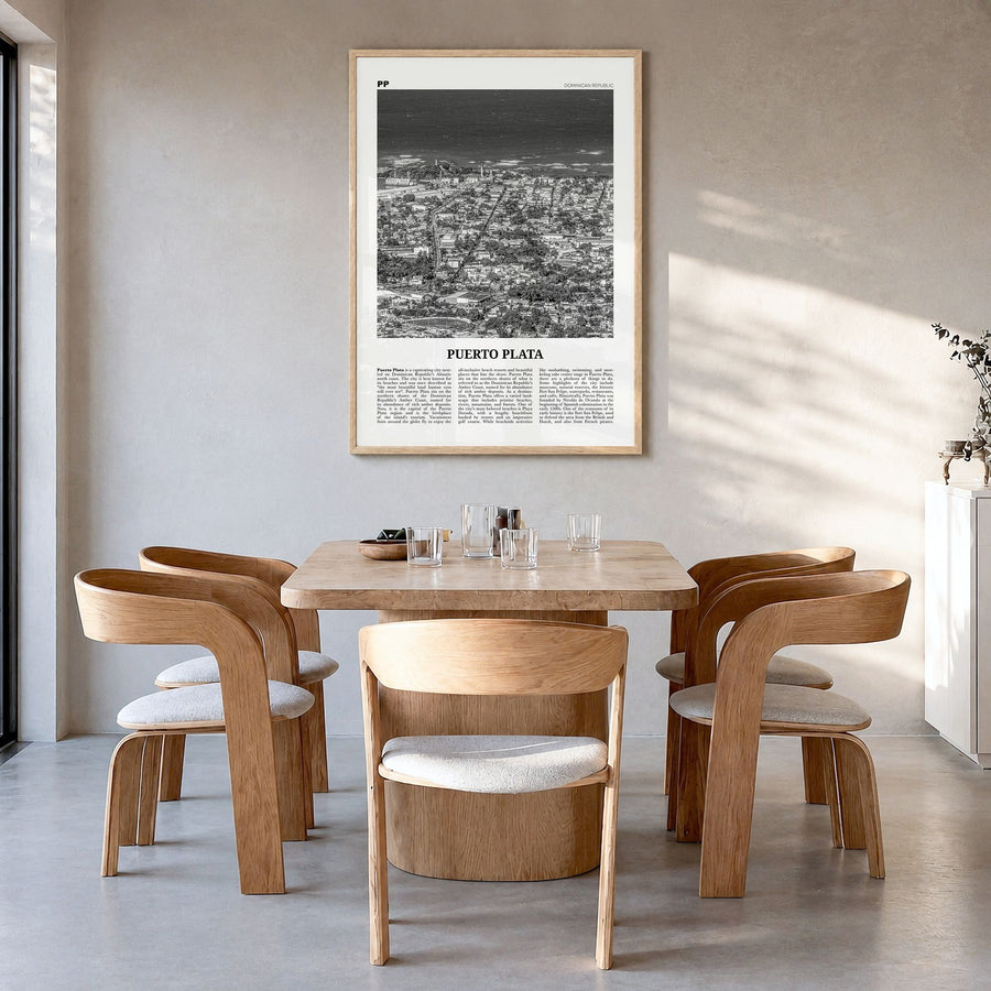 Puerto Plata Newspaper Poster in a natural wood frame, hanging in a dining room