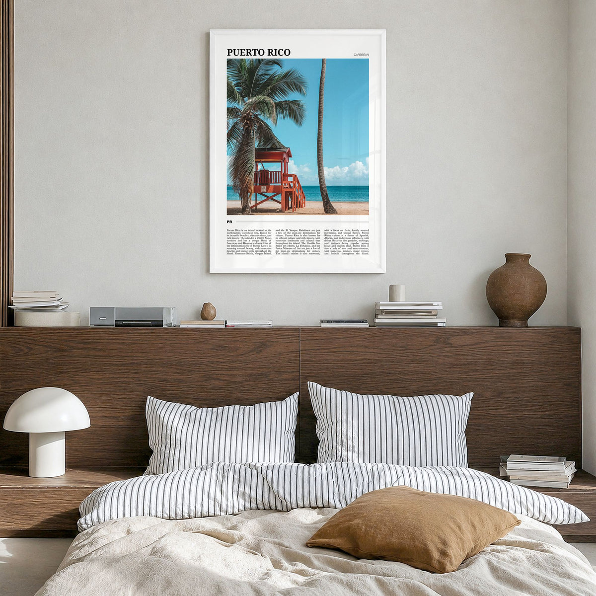 Puerto Rico Travel Poster in a white wood frame, hanging in a bedroom