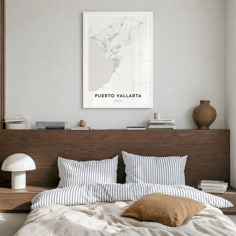 Puerto Vallarta Map Poster in a white wood frame, hanging in a bedroom