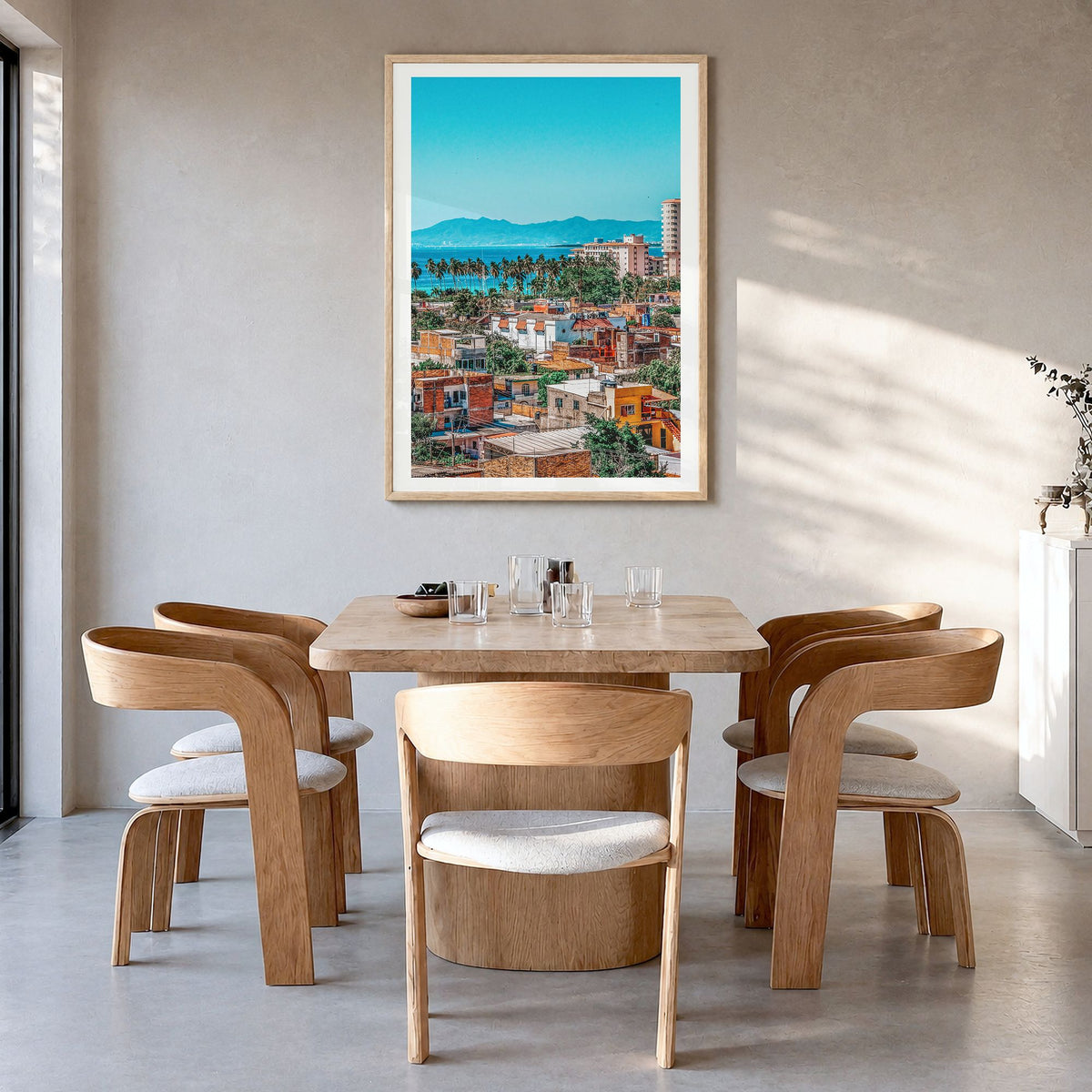 Puerto Vallarta Photo Poster in a natural wood frame, hanging in a dining room, white border