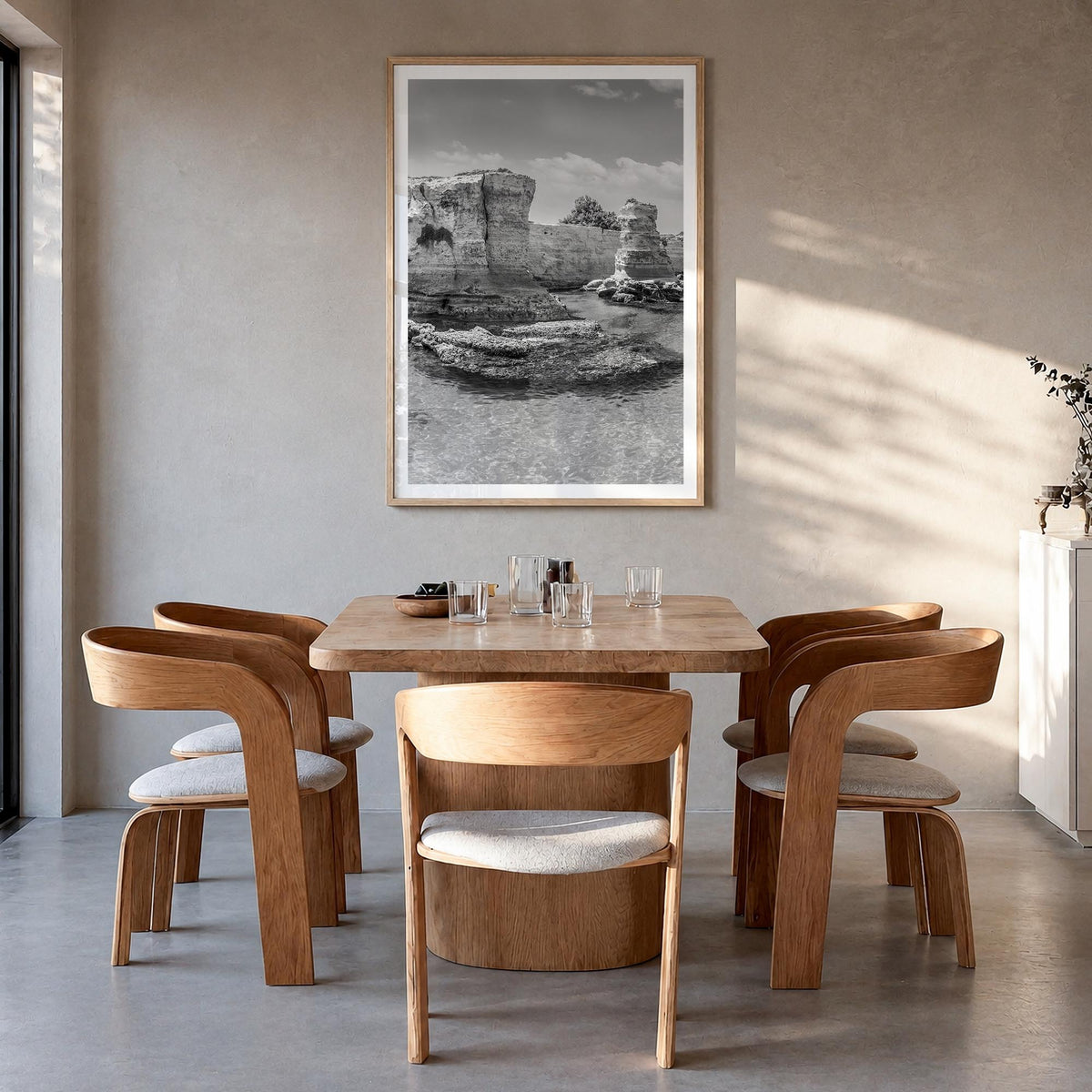 Puglia black & white photo poster of Italy – vertical wall art in natural wood frame with white border, hanging on wall