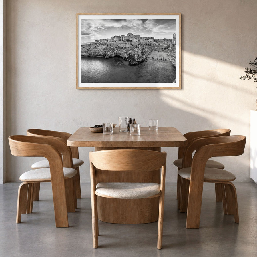 Apulia Photo Poster in a natural wood frame, hanging in a dining room, white border