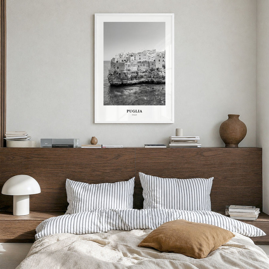 Puglia Classic Poster in a white wood frame, hanging in a bedroom