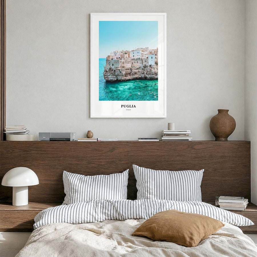 Puglia Classic Poster in a white wood frame, hanging in a bedroom