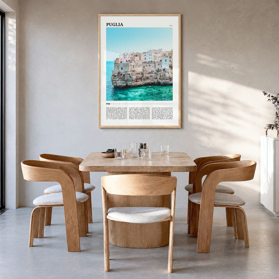 Puglia Travel Poster in a natural wood frame, hanging in a dining room