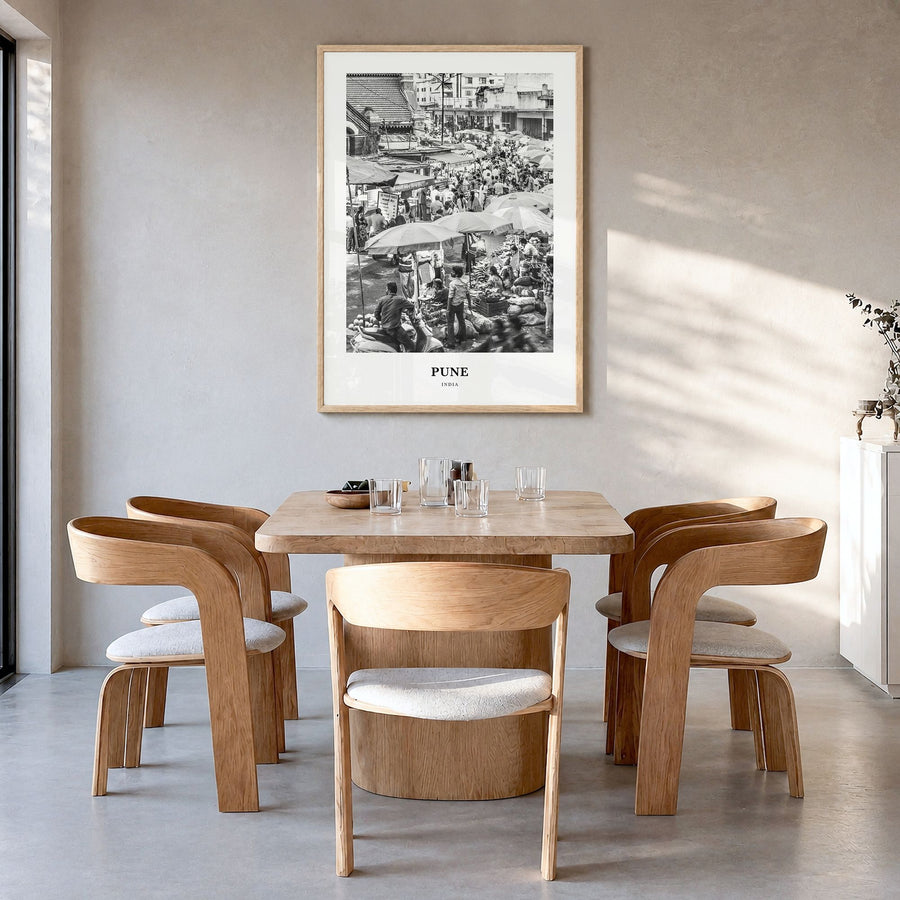 Pune Classic Poster in a natural wood frame, hanging in a dining room