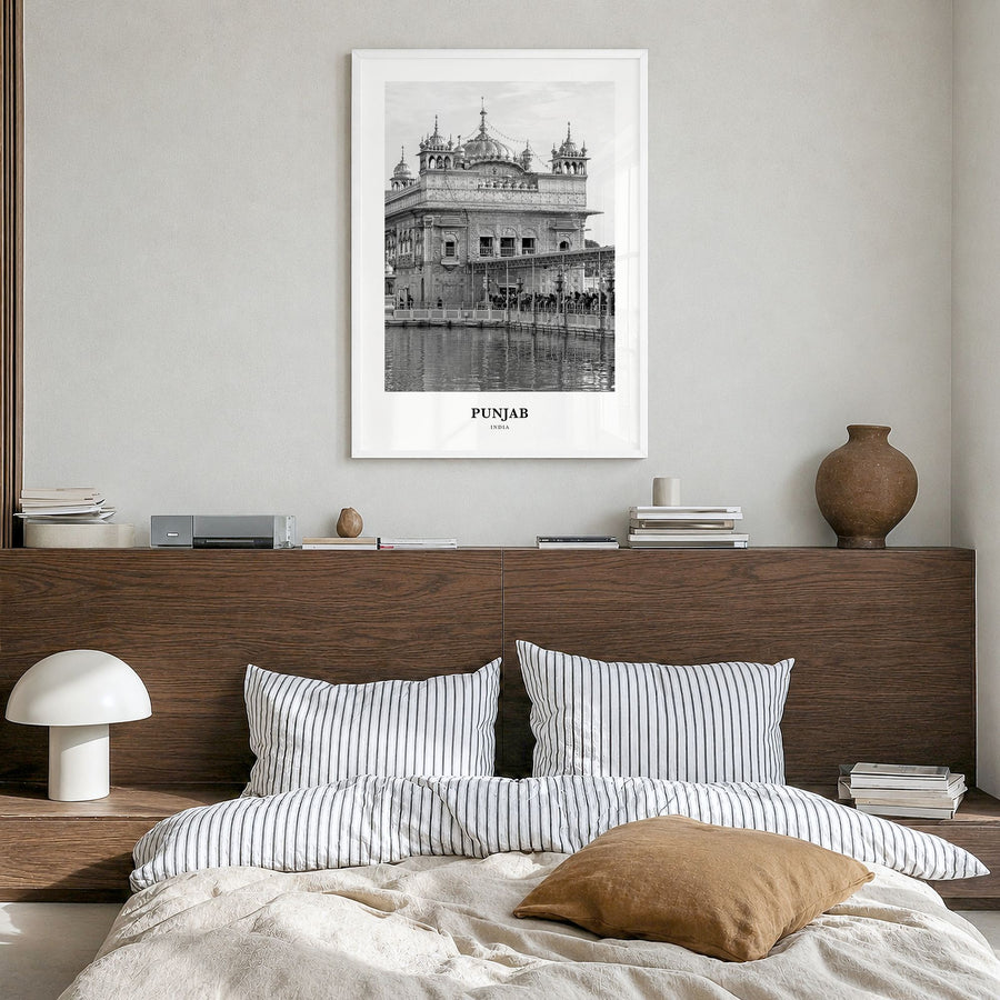 Punjab Classic Poster in a white wood frame, hanging in a bedroom