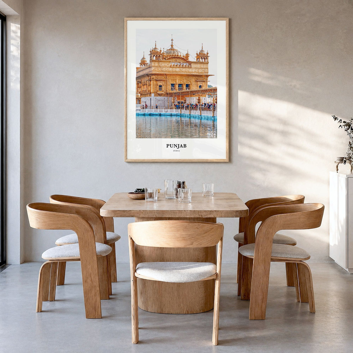 Punjab Classic Poster in a natural wood frame, hanging in a dining room