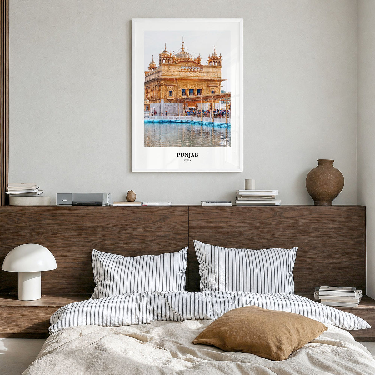 Punjab Classic Poster in a white wood frame, hanging in a bedroom