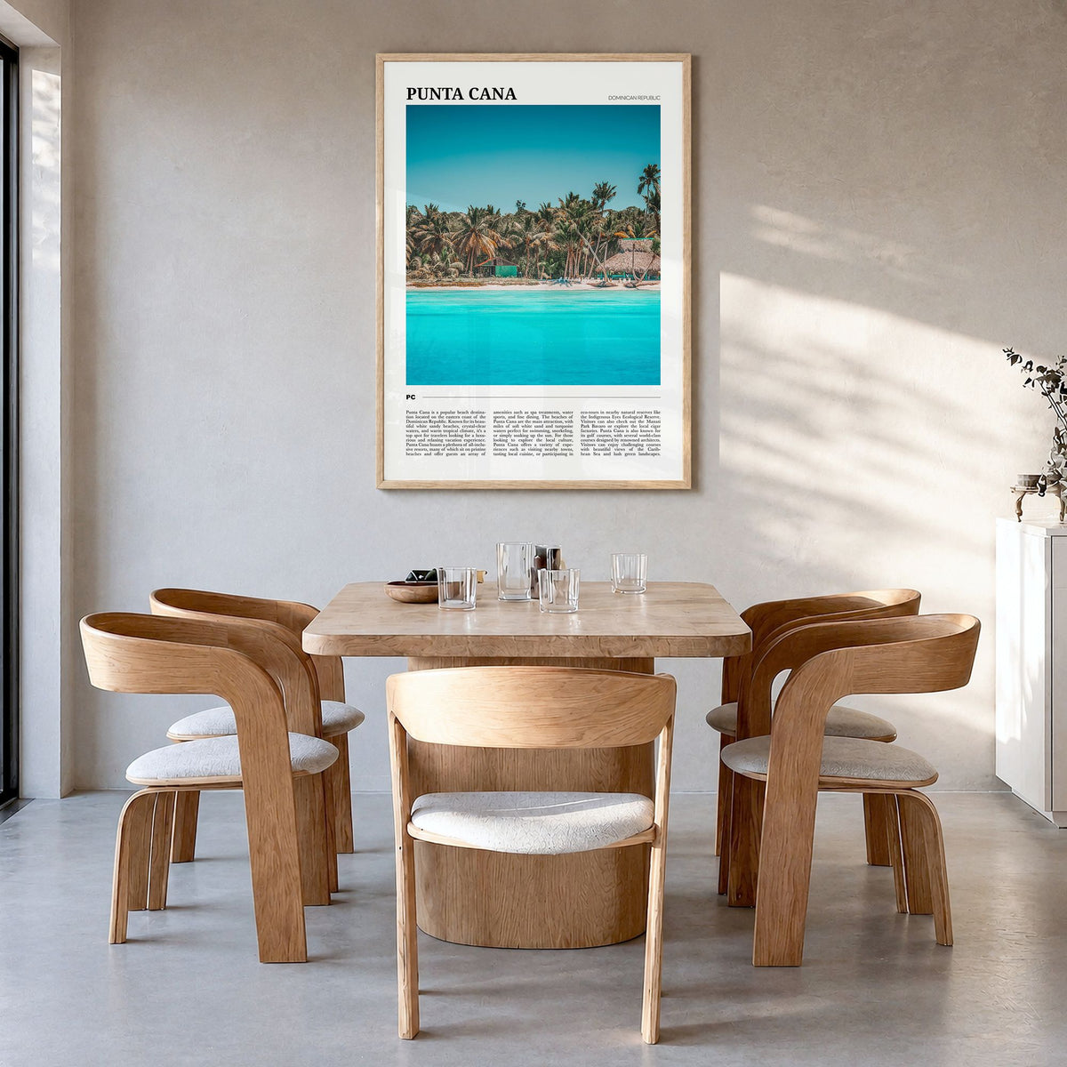Punta Cana Travel Poster in a natural wood frame, hanging in a dining room