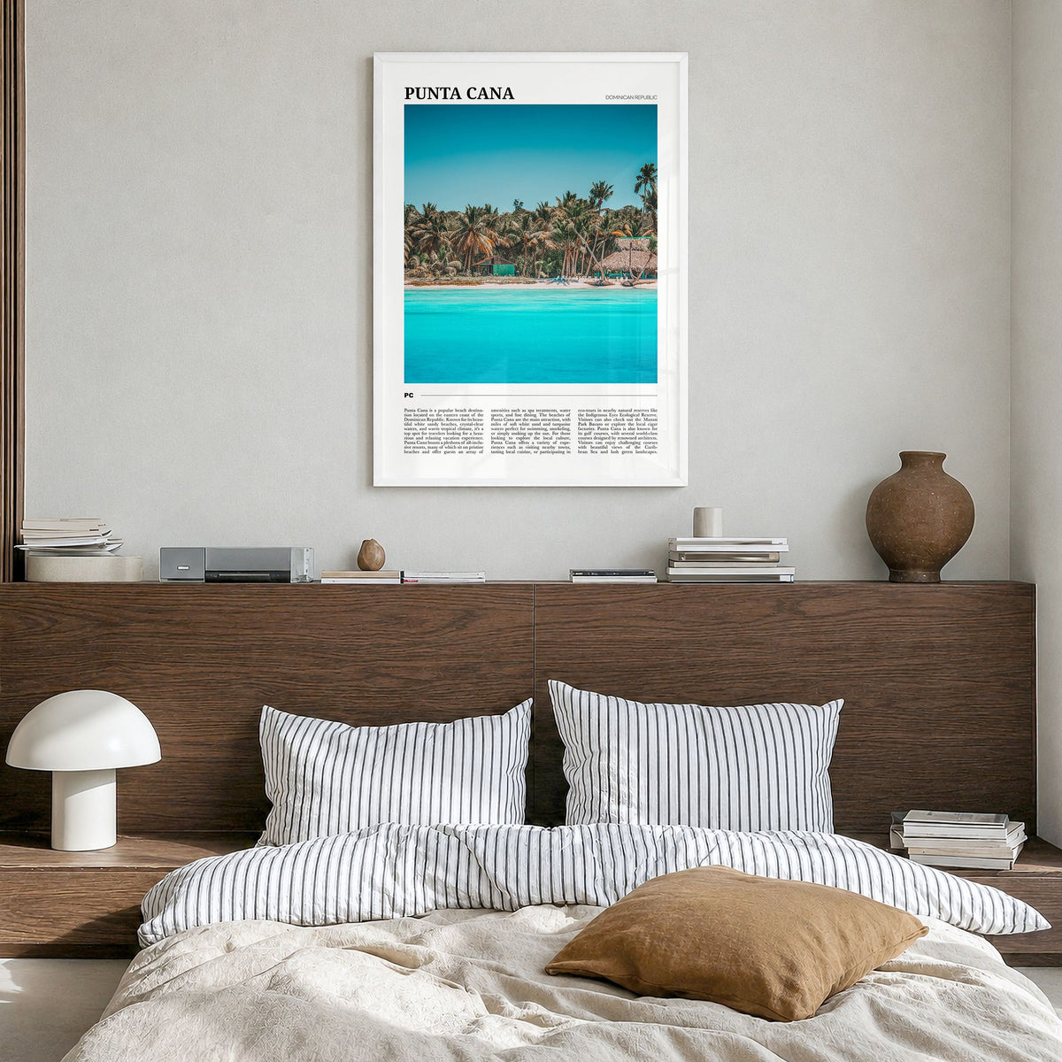 Punta Cana Travel Poster in a white wood frame, hanging in a bedroom