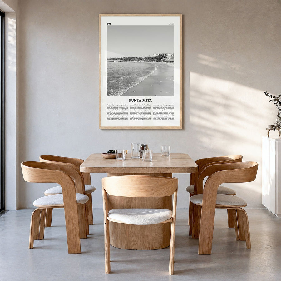 Punta Mita Newspaper Poster in a natural wood frame, hanging in a dining room
