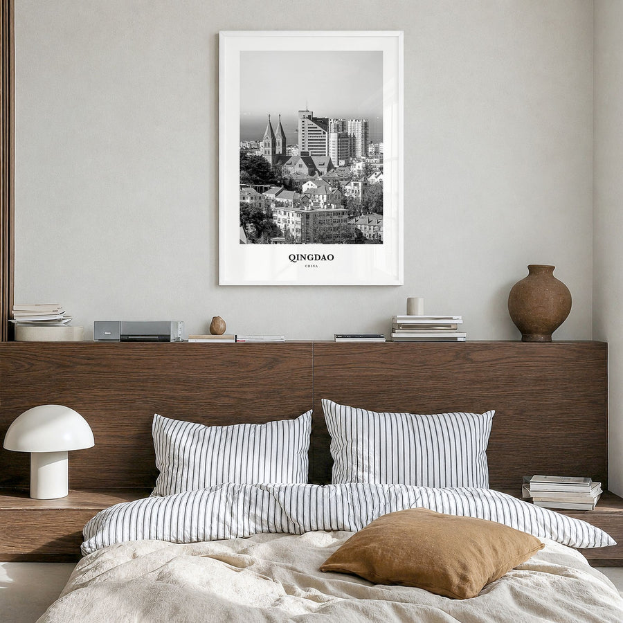 Qingdao Classic Poster in a white wood frame, hanging in a bedroom