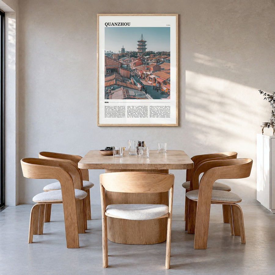 Quanzhou Travel Poster in a natural wood frame, hanging in a dining room