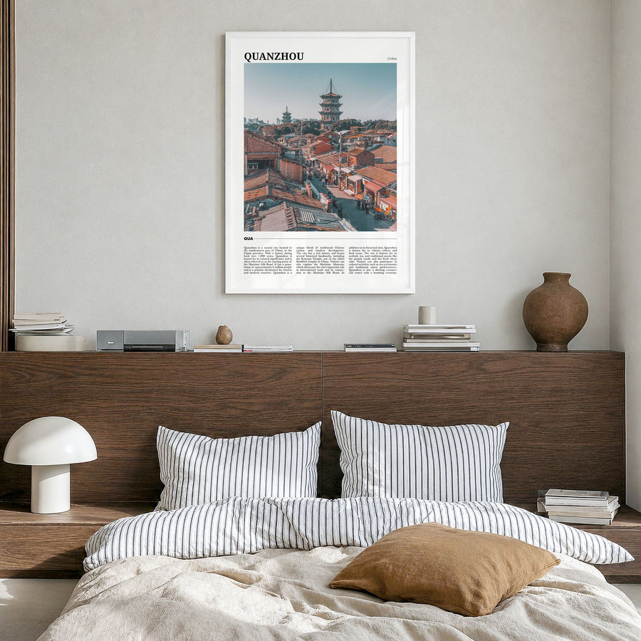Quanzhou Travel Poster in a white wood frame, hanging in a bedroom
