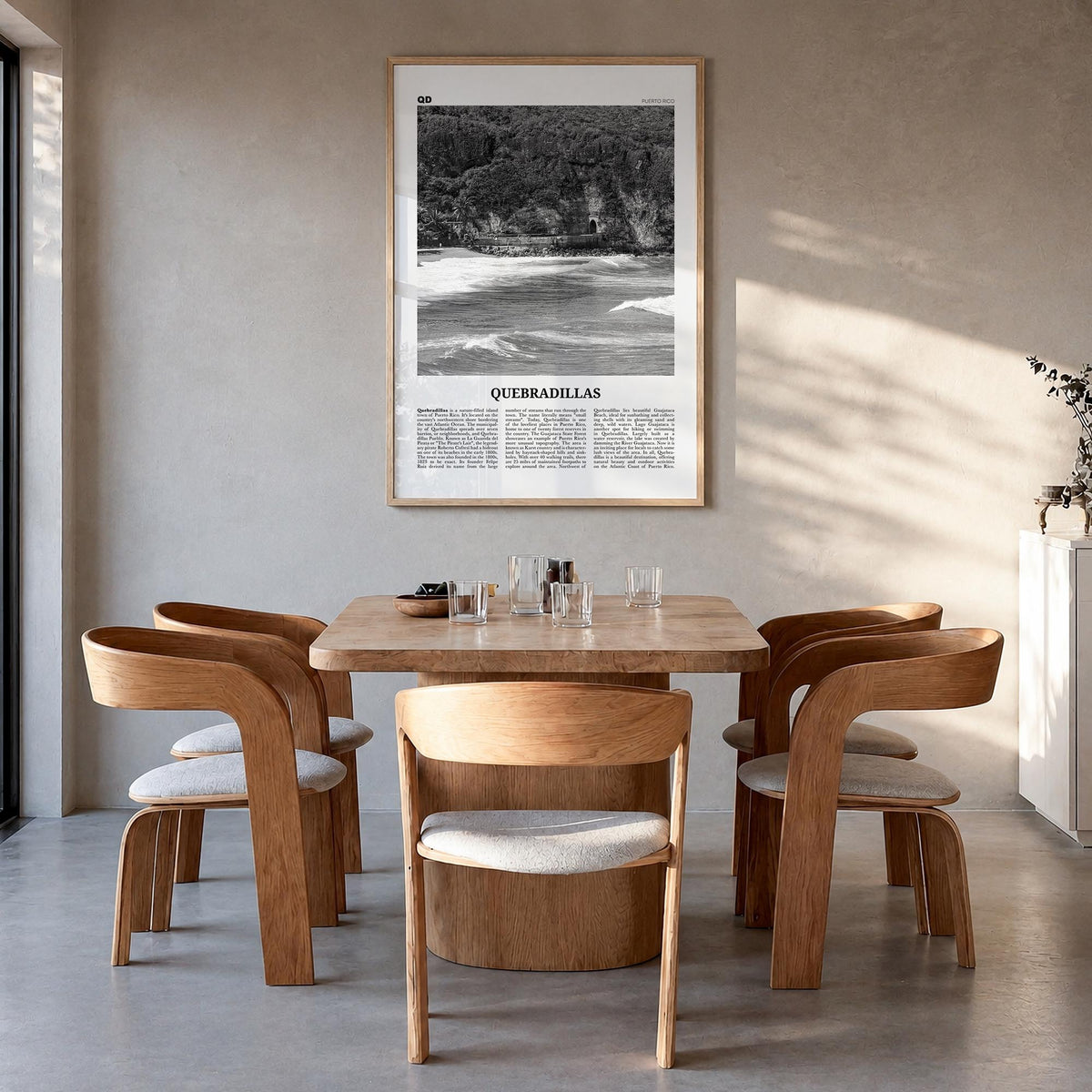 Quebradillas black & white newspaper poster of Puerto Rico – vertical wall art in natural wood frame, hanging on wall
