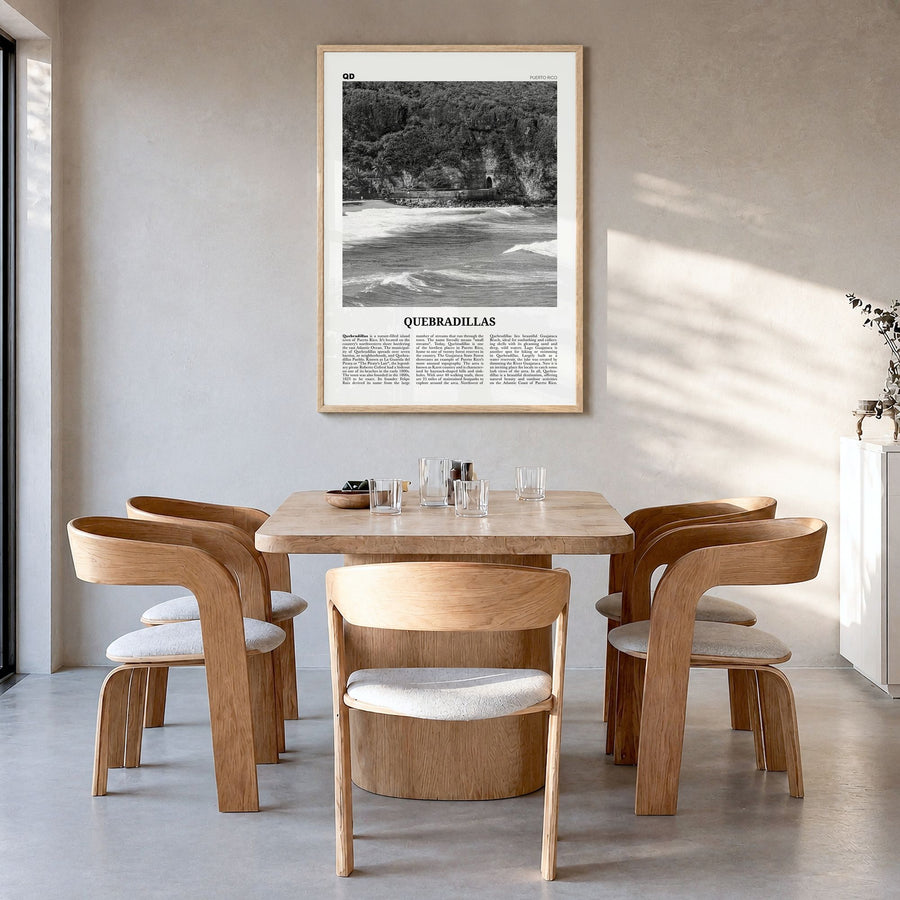 Quebradillas Newspaper Poster in a natural wood frame, hanging in a dining room