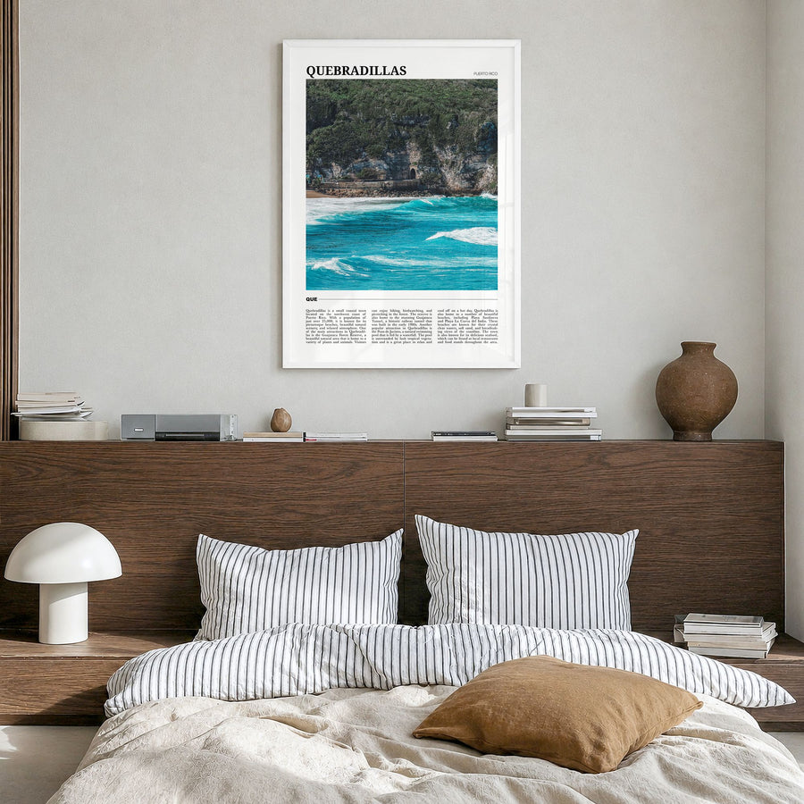Quebradillas Travel Poster in a white wood frame, hanging in a bedroom