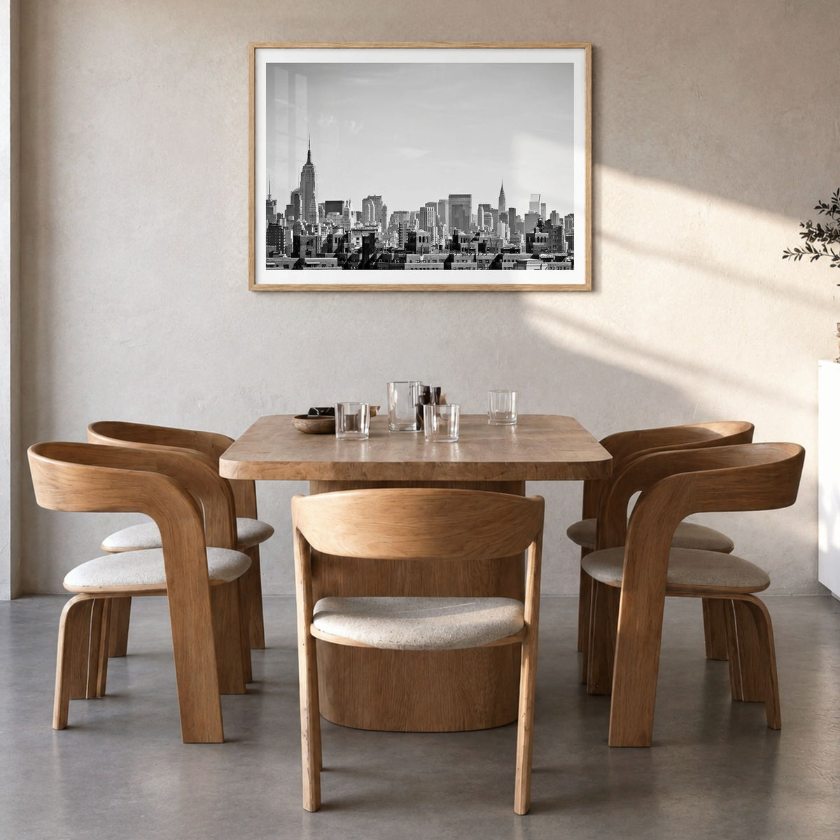 Queens, New York Photo Poster in a natural wood frame, hanging in a dining room, white border