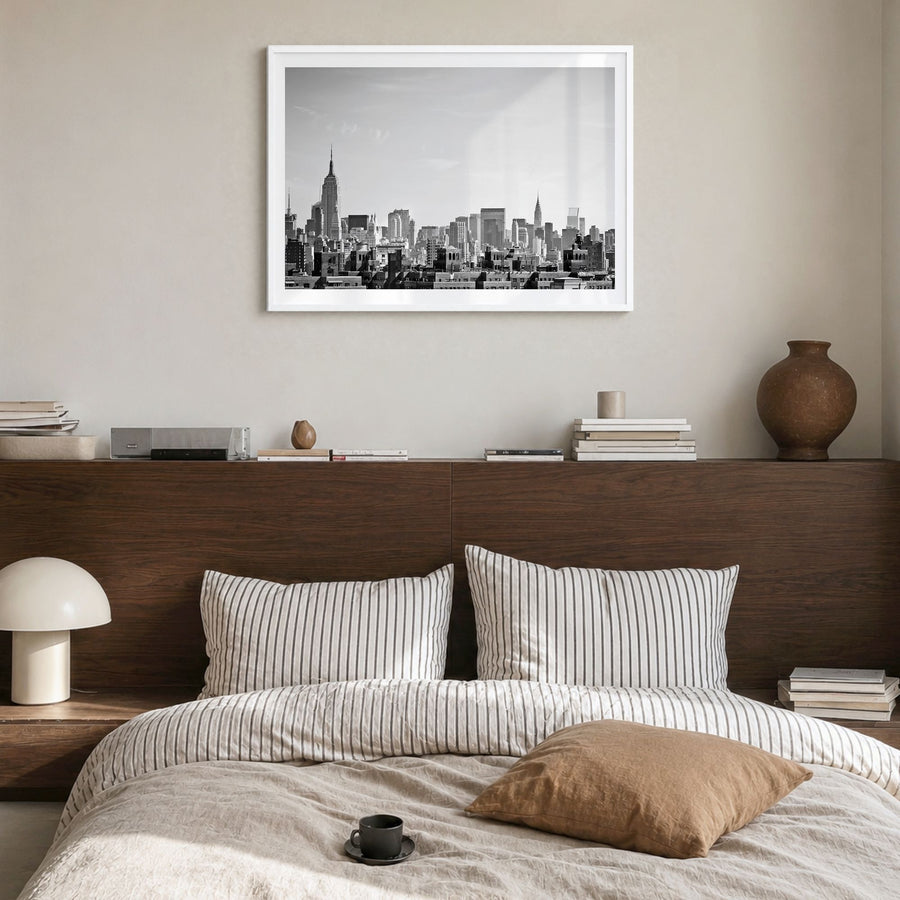 Queens, New York Photo Poster in a white wood frame, hanging in a bedroom, white border