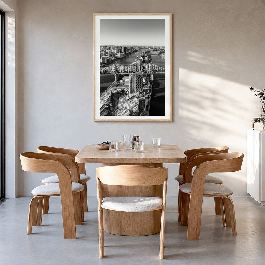 Queens, New York Photo Poster in a natural wood frame, hanging in a dining room, white border