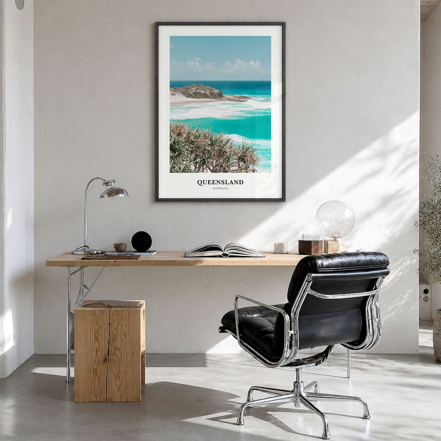 Queensland Classic Poster in a black wood frame, hanging in a bright home office
