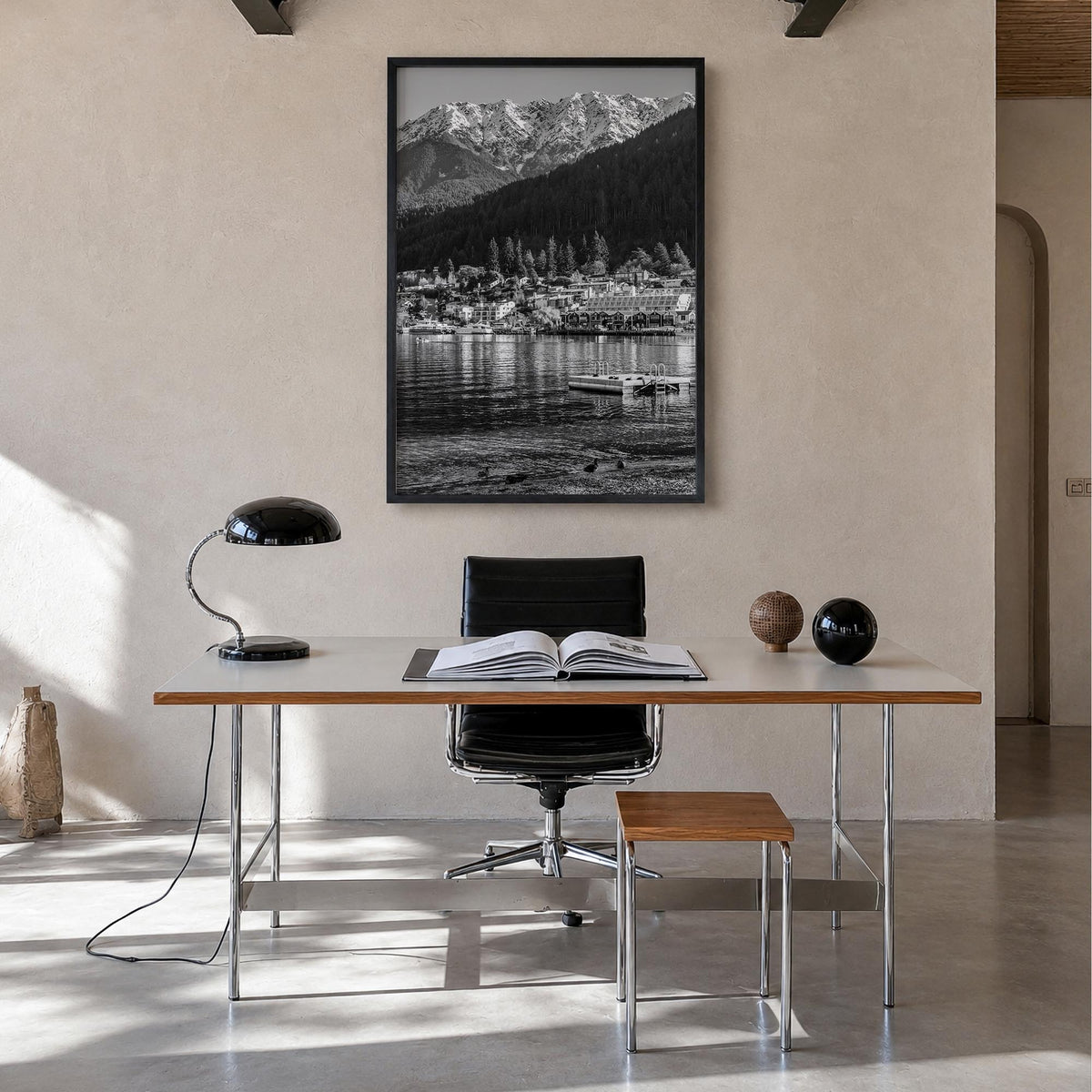 Queenstown black & white photo poster of New Zealand – vertical wall art in black wood frame, hanging on wall