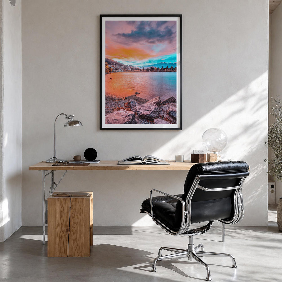 Queenstown colorful photo poster of New Zealand – vertical wall art in black wood frame with white border, hanging on wall