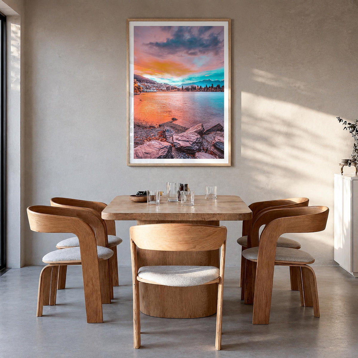 Queenstown colorful photo poster of New Zealand – vertical wall art in natural wood frame with white border, hanging on wall