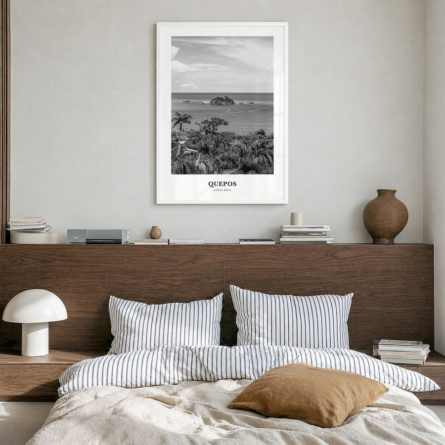 Quepos Classic Poster in a white wood frame, hanging in a bedroom